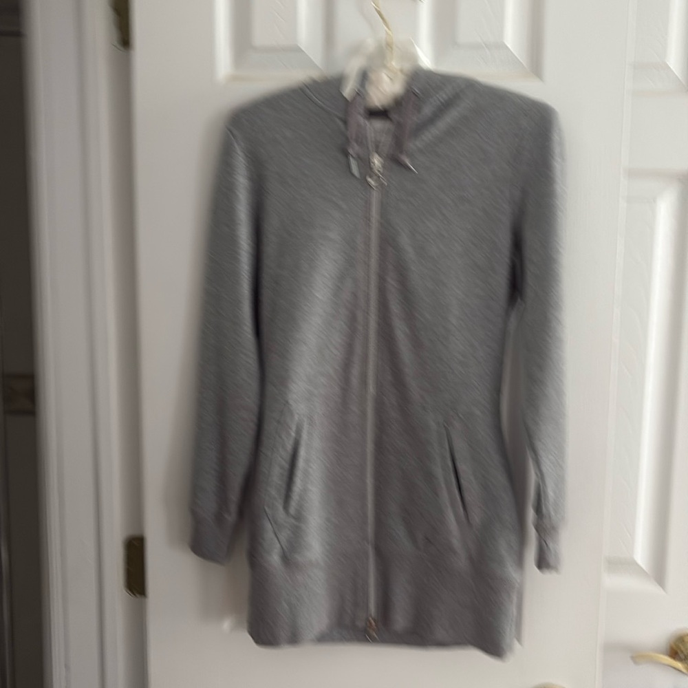 Ladies Niki zip sweat shirt . Fittted size small . 26in long. Never used
